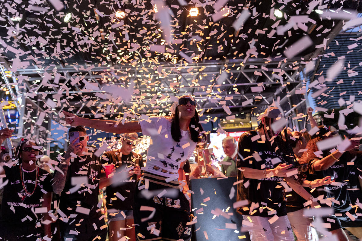 Confetti rains down on the 2022 WNBA Champions, the Las Vegas Aces, during a parade to honor th ...