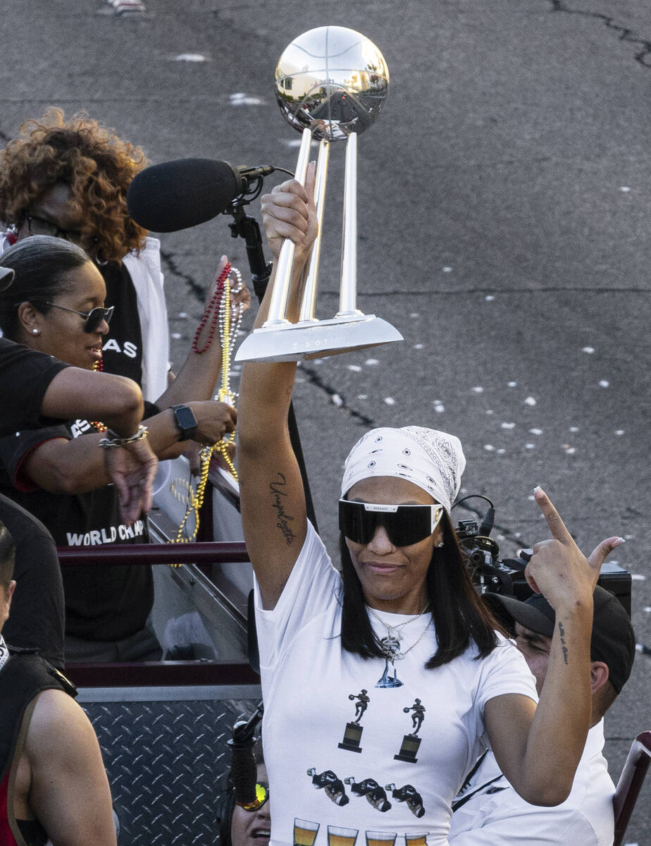 Las Vegas Aces' A'ja Wilson holds up the championship trophy during the team's WNBA Championshi ...