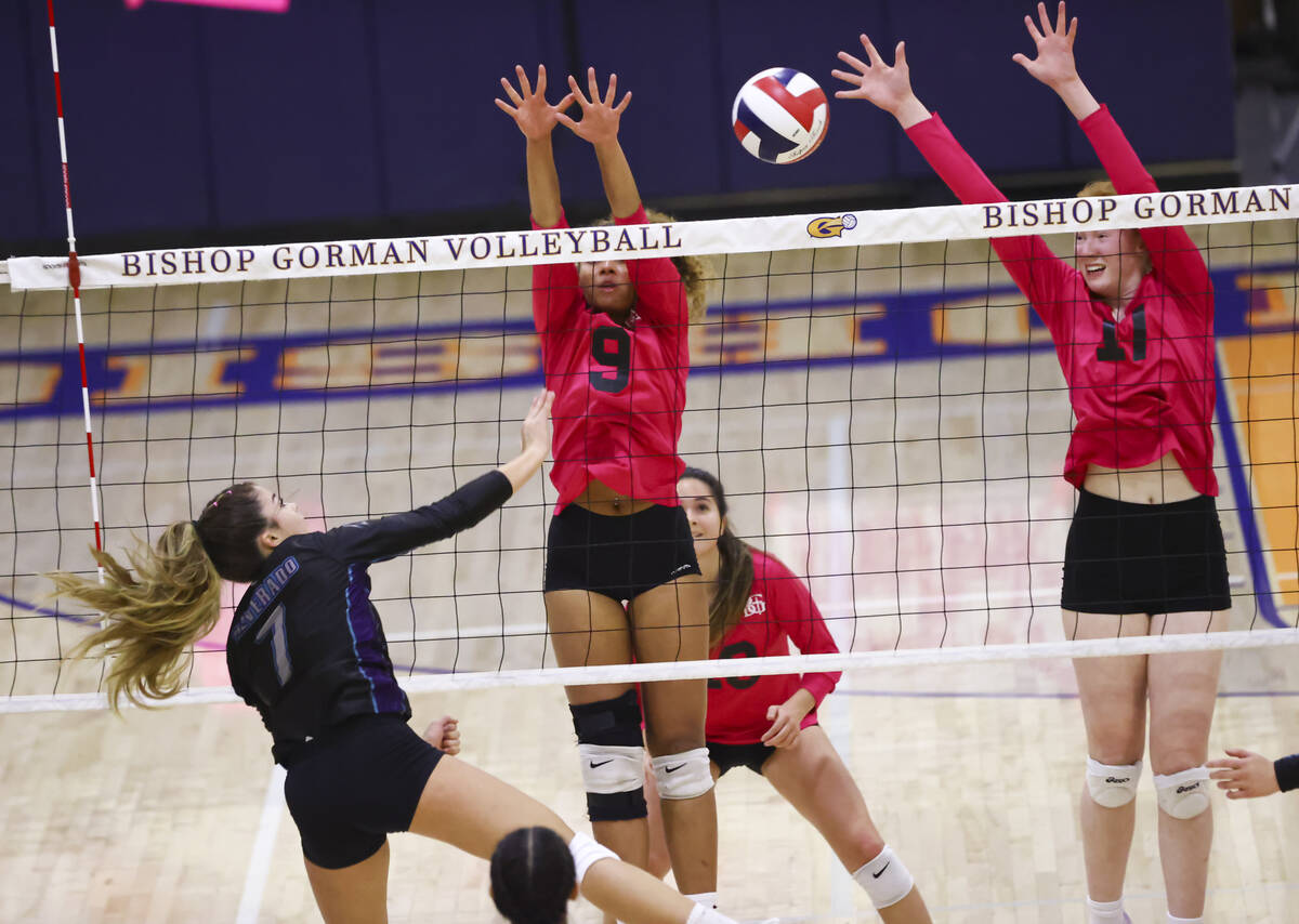 Bishop Gorman's Ashley Duckworth (17) and Imani Dambreville (9) block a shot from Silverado's R ...