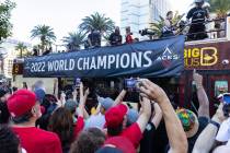 Fans watch as the Las Vegas Aces pass by during the team's WNBA Championship victory parade on ...