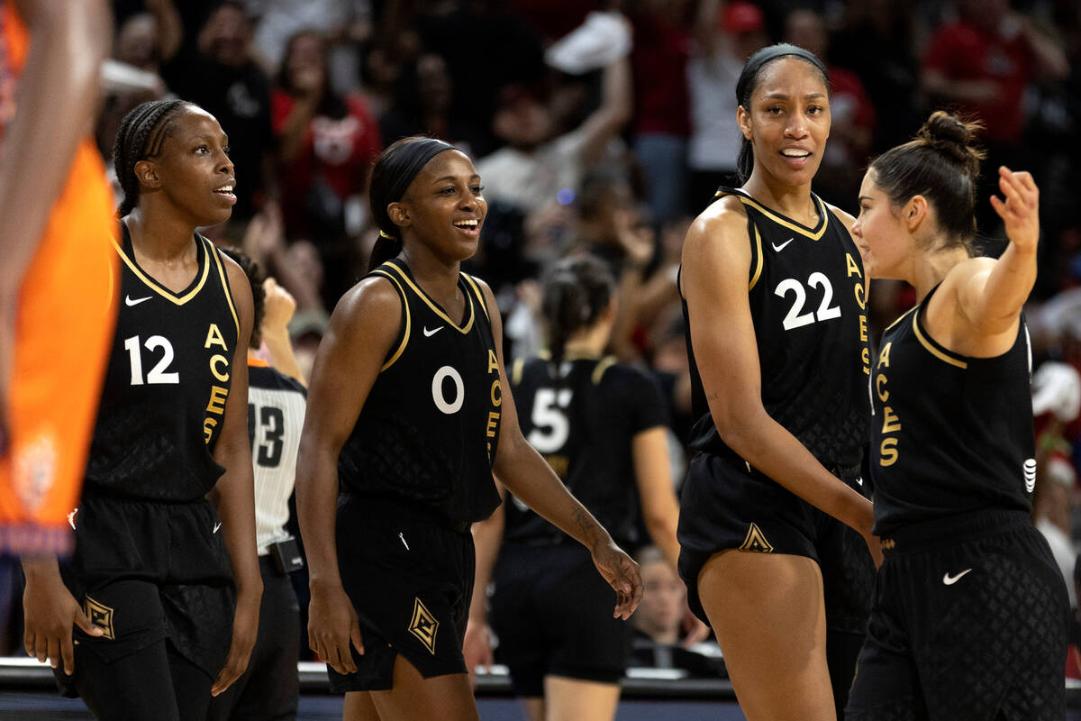 Las Vegas Aces guard Chelsea Gray (12), guard Jackie Young (0), forward A'ja Wilson (22) and gu ...