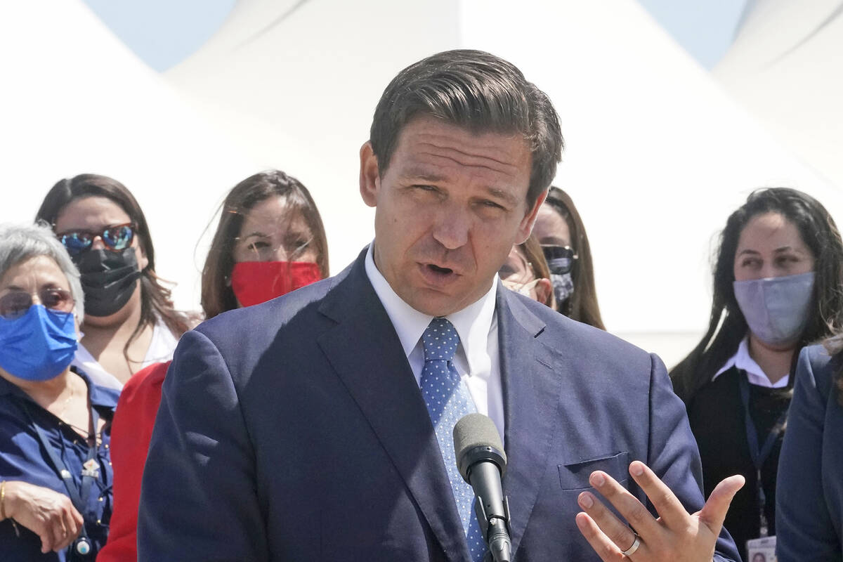 Florida Gov. Ron DeSantis speaks during a news conference, Thursday, April 8, 2021, at PortMiam ...