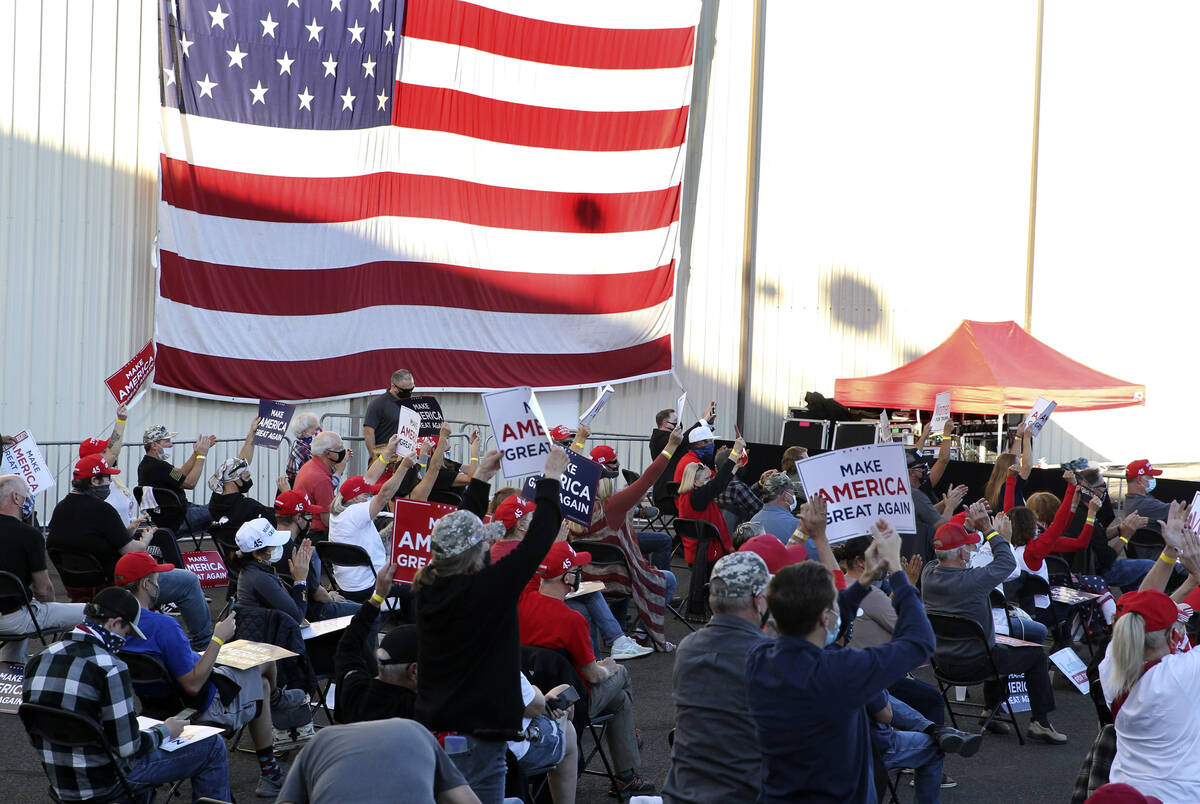 Supporters respond to a speech by Vice President Mike Pence at a campaign rally at Reno-Tahoe I ...