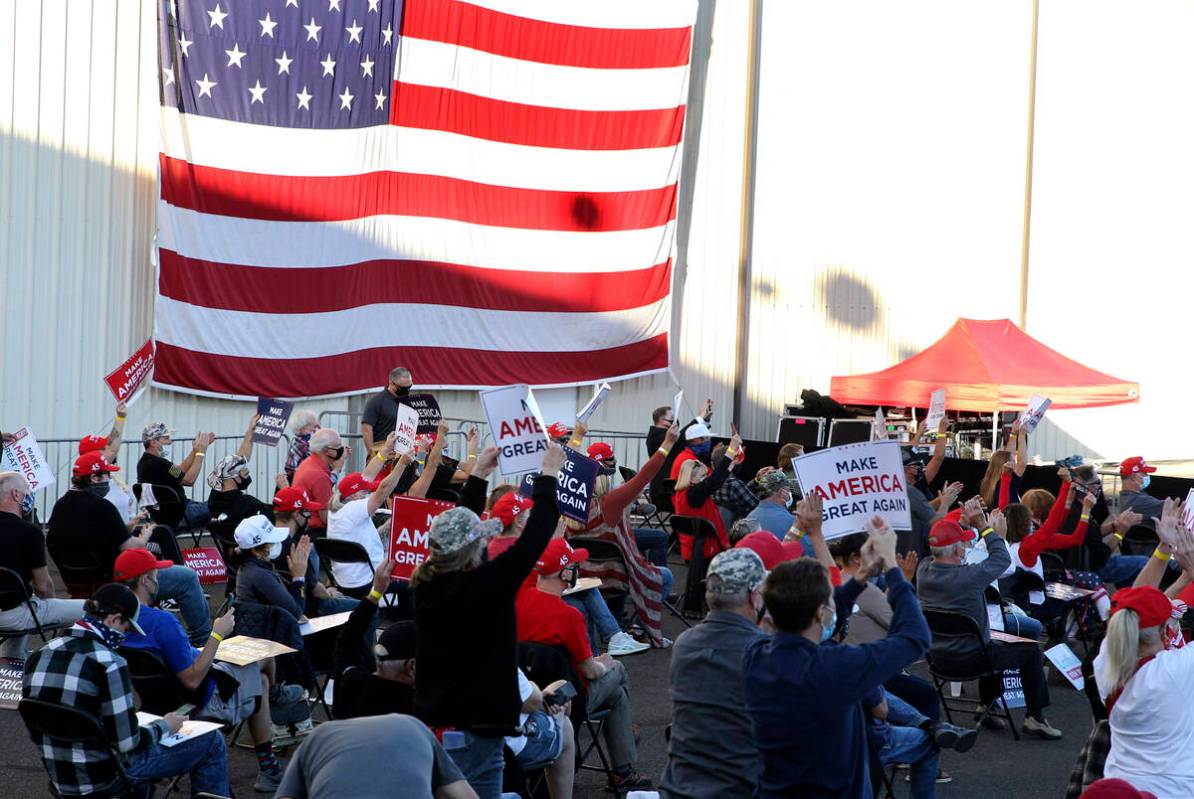 Supporters respond to a speech by Vice President Mike Pence at a campaign rally at Reno-Tahoe I ...