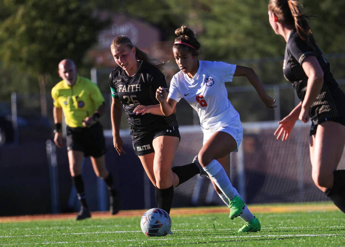 Coronado's Milan Cordone (6) moves the ball up the field against Faith Lutheran's Taylor Folk ( ...