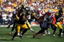 Pittsburgh Steelers running back Najee Harris (22) carries the ball in the second half during a ...
