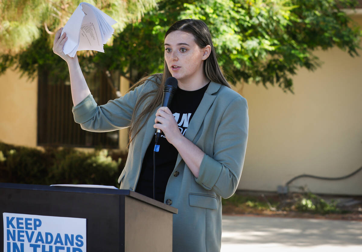 Cassie Charles, campaign director of PLAN Action, speaks during a press conference as a call fo ...