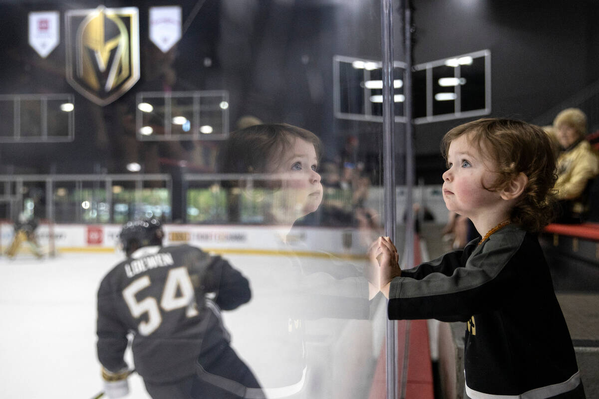 Wolf Dyal, 1, watches the Vegas Golden Knights on the ice for the first time during the first d ...