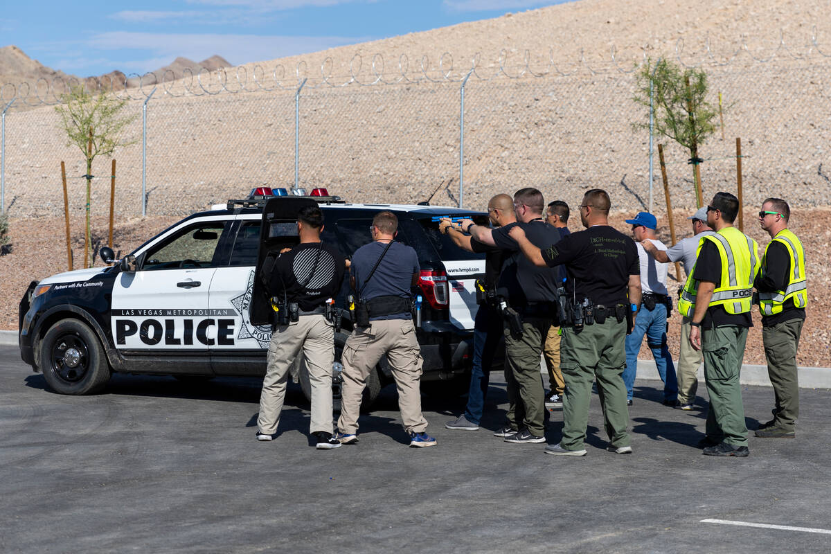 Las Vegas police officer participate during a down citizen rescue scenario at the Reality Based ...