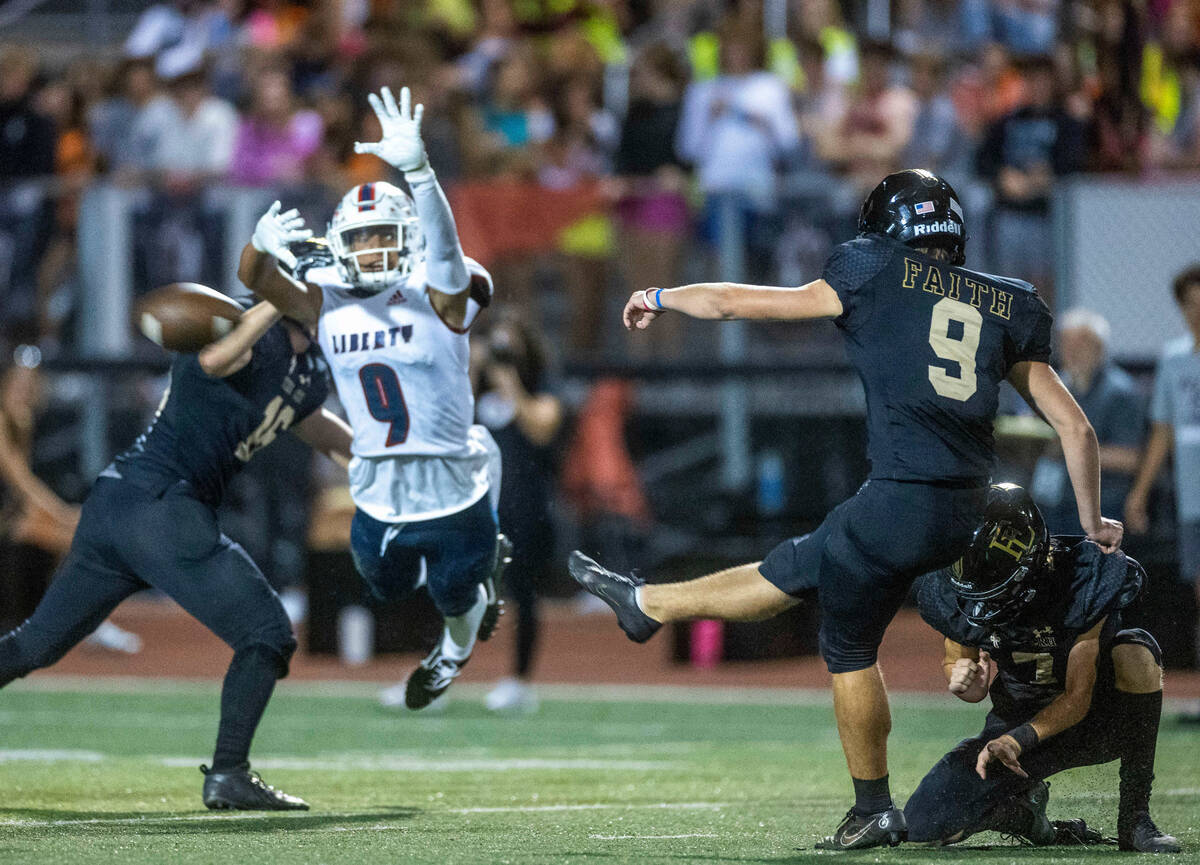 Faith Lutheran kicker Caden Chittenden (9) makes a successful field goal as Liberty safety Asht ...