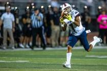 Liberty wide receiver Jayden Robertson (7) looks in a long reception for a touchdown over Faith ...