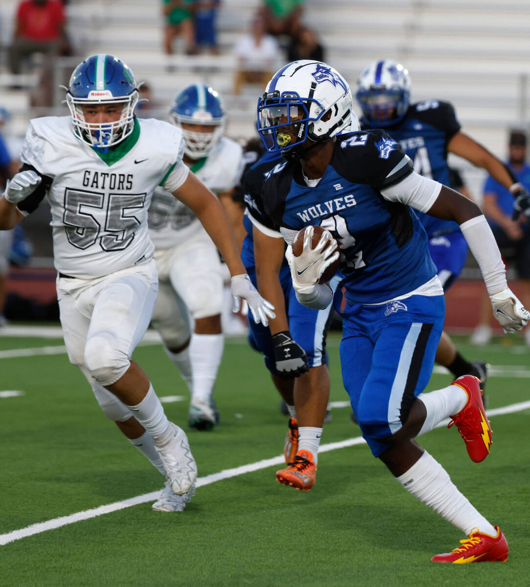 Basic High's wide receiver Chrey Traylor (2) runs with ball against Green Valley High's defensi ...