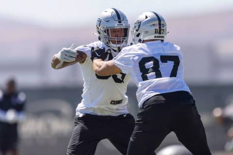 Raiders tight end Foster Moreau (87) works against tight end Darren Waller (83) during practice ...