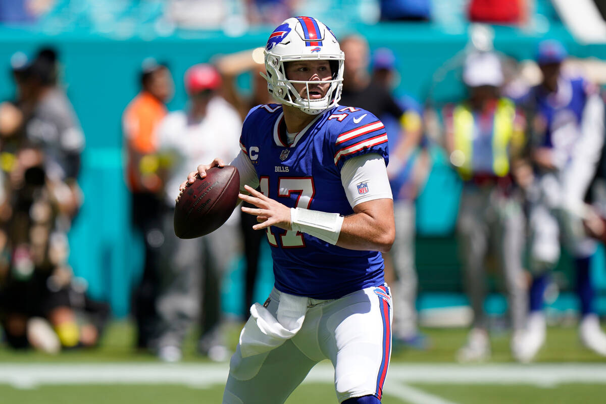 Buffalo Bills quarterback Josh Allen (17) aims a pass during the first half of an NFL football ...