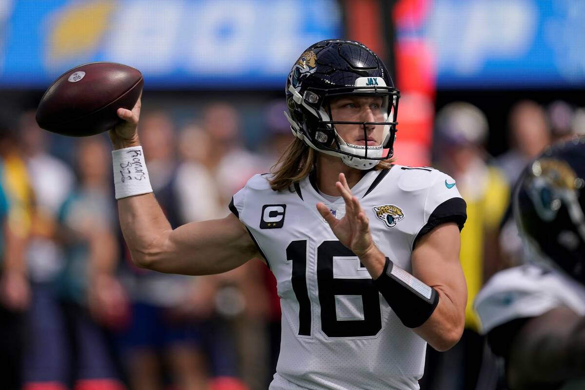 Jacksonville Jaguars quarterback Trevor Lawrence (16) passes against the Los Angeles Chargers d ...