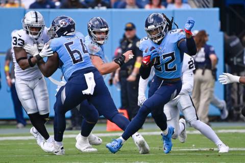 Tennessee Titans running back Derrick Henry (22) carries the ball against the Las Vegas Raiders ...