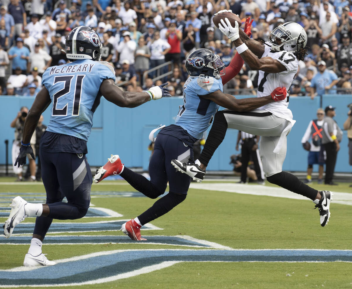 Raiders wide receiver Davante Adams (17) makes a touchdown catch over Tennessee Titans safety K ...