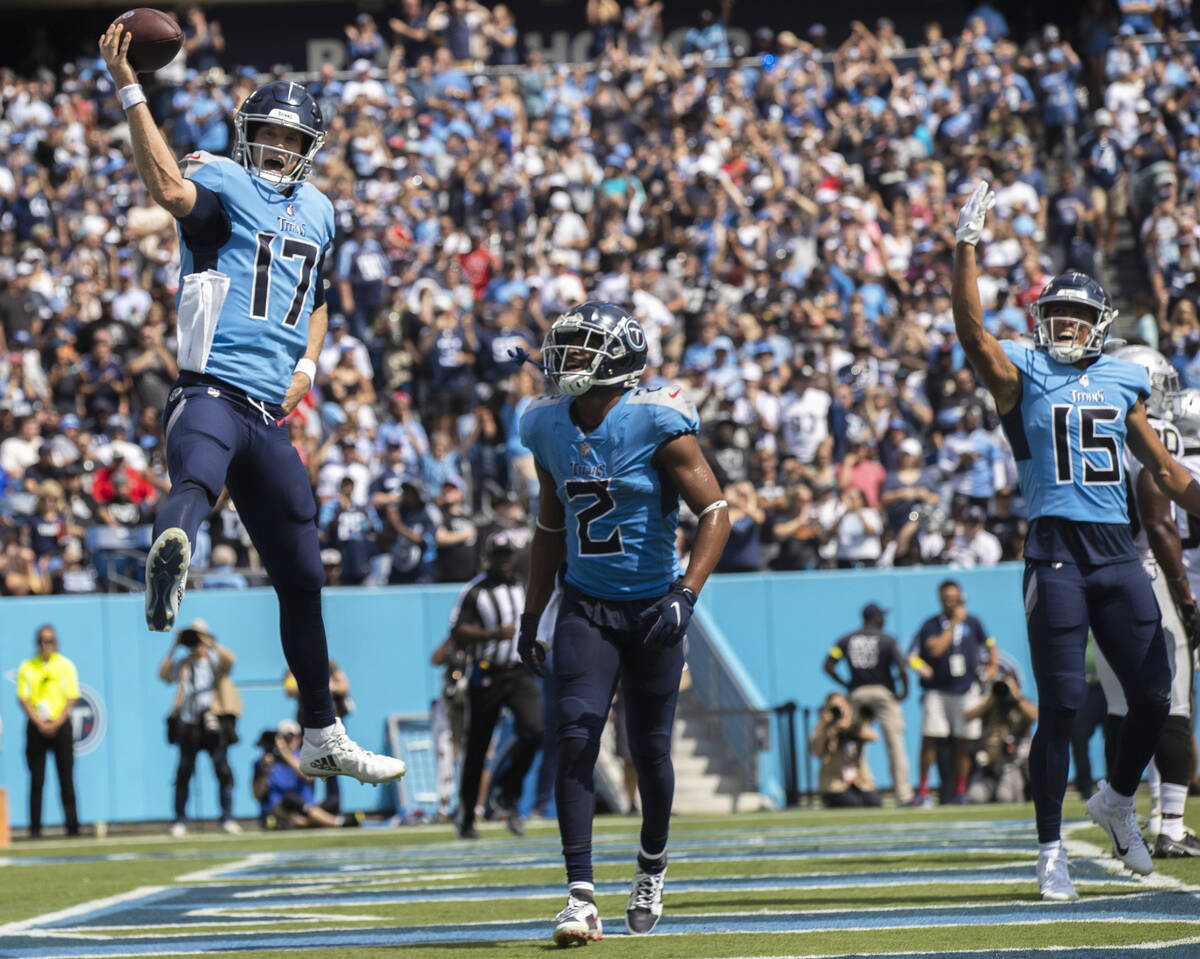 Tennessee Titans quarterback Ryan Tannehill (17) celebrates a touchdown with Tennessee Titans w ...