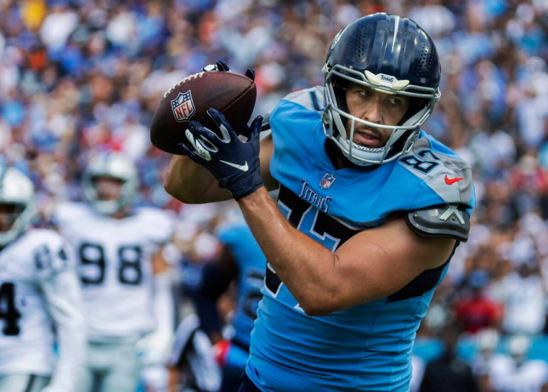 Tennessee Titans tight end Geoff Swaim (87) scores a touchdown past Raiders defensive end Maxx ...