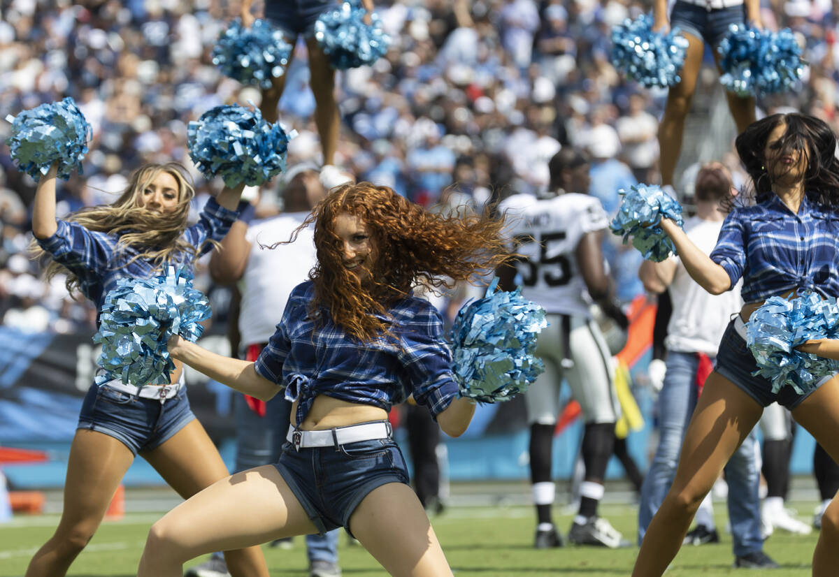 Titans cheerleaders perform in the first half during an NFL football game against the Raiders o ...