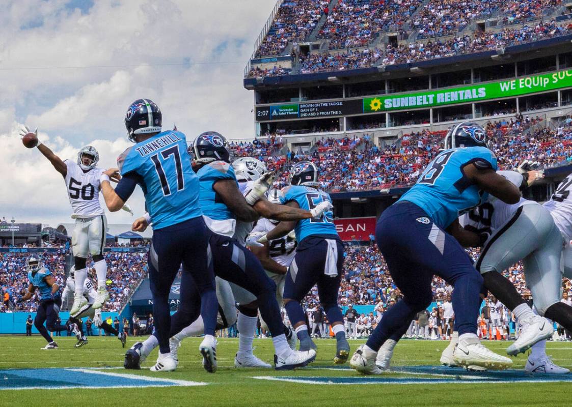 Raiders linebacker Jayon Brown (50) knocks down a pass by Tennessee Titans quarterback Ryan Tan ...