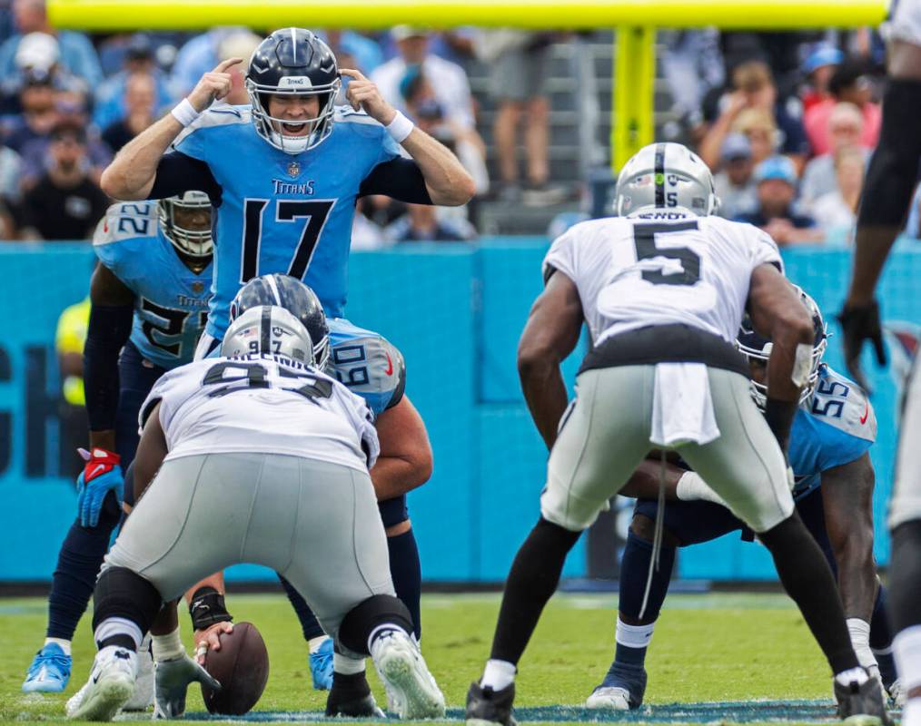 Tennessee Titans quarterback Ryan Tannehill (17) calls an audible with Raiders linebacker Divin ...