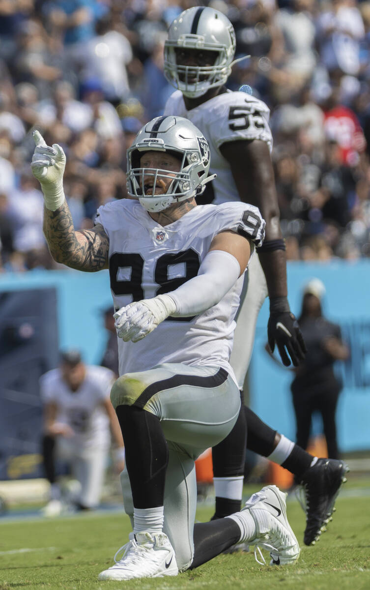 Raiders defensive end Maxx Crosby celebrates a big play in the second half during an NFL footb ...