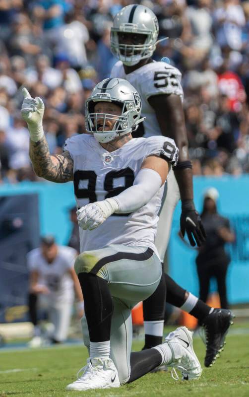 Raiders defensive end Maxx Crosby celebrates a big play in the second half during an NFL footb ...