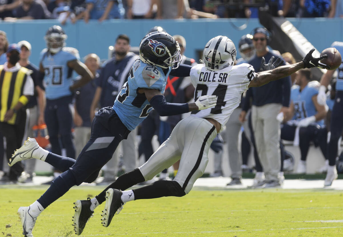 Raiders wide receiver Keelan Cole (84) dives to try and make a catch with Tennessee Titans corn ...