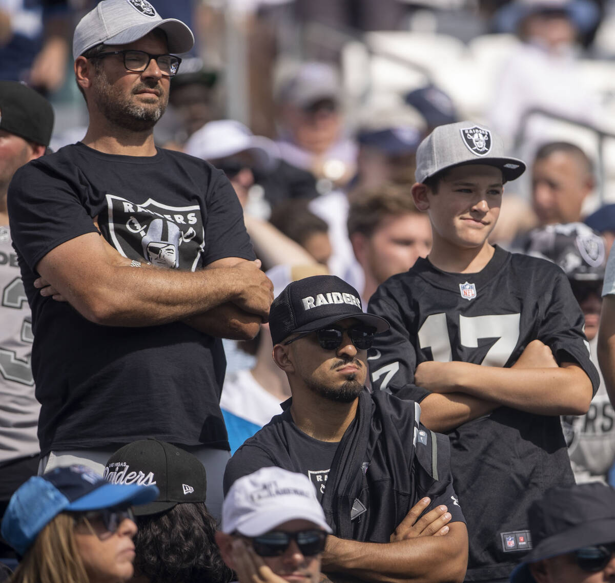 Raiders fans watch the team play the second half of an NFL game against the Tennessee Titans at ...
