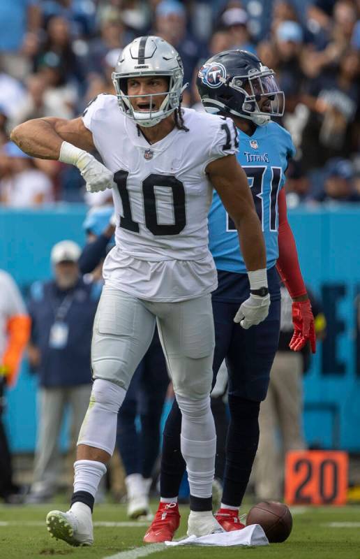 Raiders wide receiver Mack Hollins (10) celebrates a catch over Tennessee Titans safety Kevin B ...