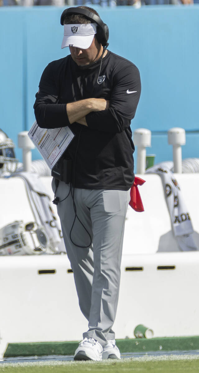 Raiders head coach Josh McDaniels walks the sidelines in the second half during an NFL football ...