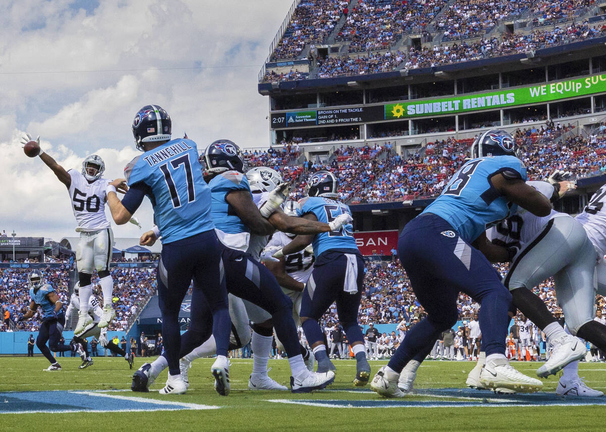 Raiders linebacker Jayon Brown (50) knocks down a pass by Tennessee Titans quarterback Ryan Tan ...