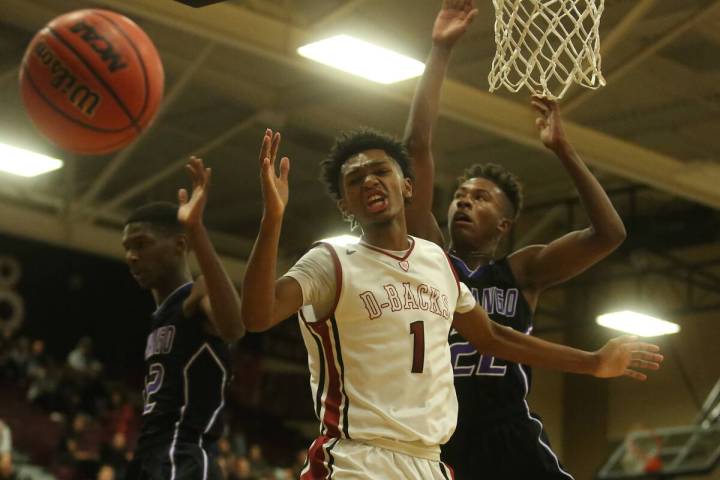 Desert Oasis player Felix Reeves (1) looses the ball to Durango during a game at Desert Oasis H ...