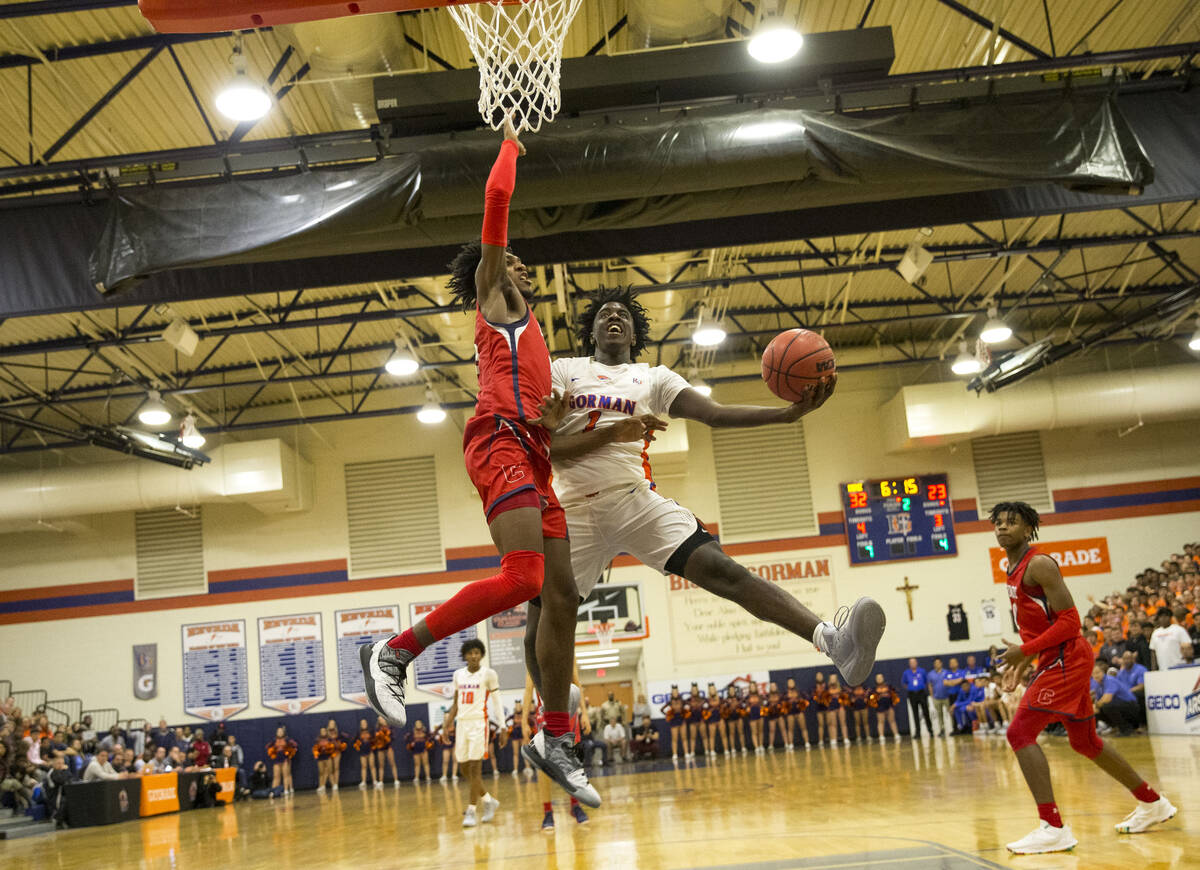 Bishop Gorman's Will McClendon (1) goes up for a shot against Coronado's Felix Reeves (5) durin ...