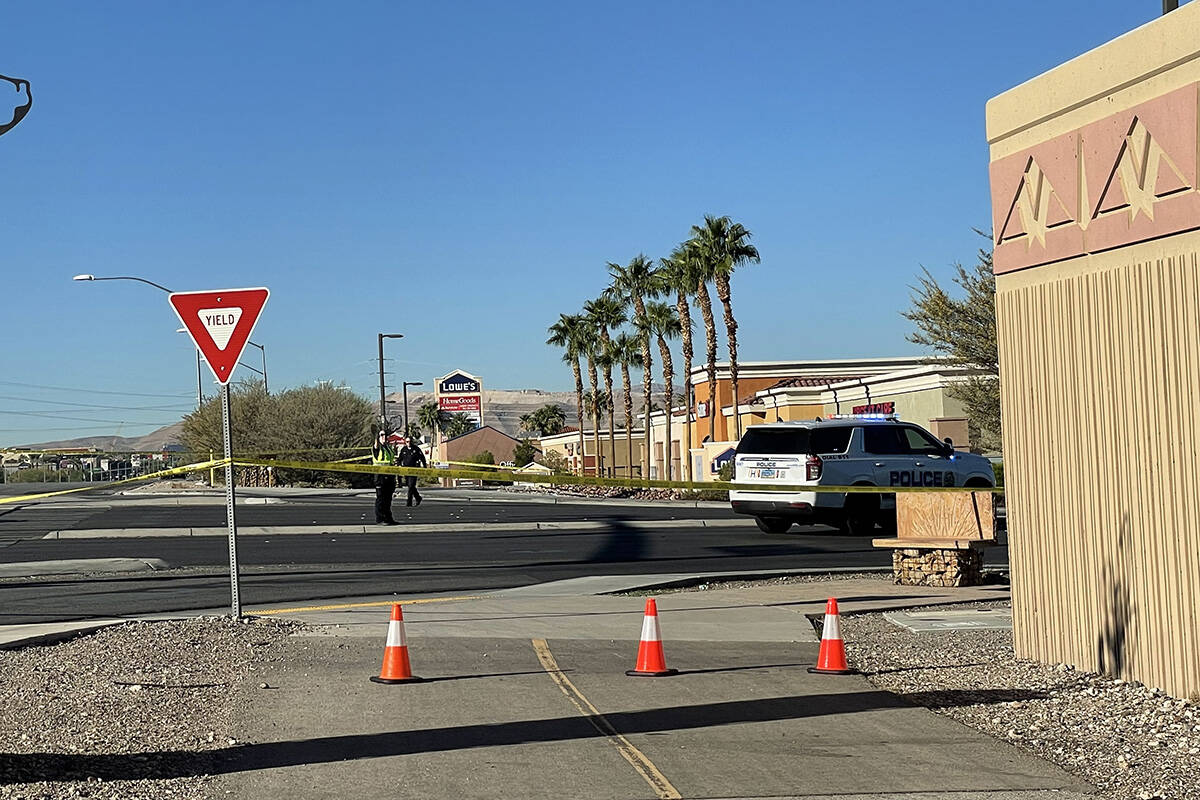 Police investigate an exchange of gunfire between an officer and a suspect Monday, Sept. 26, 20 ...