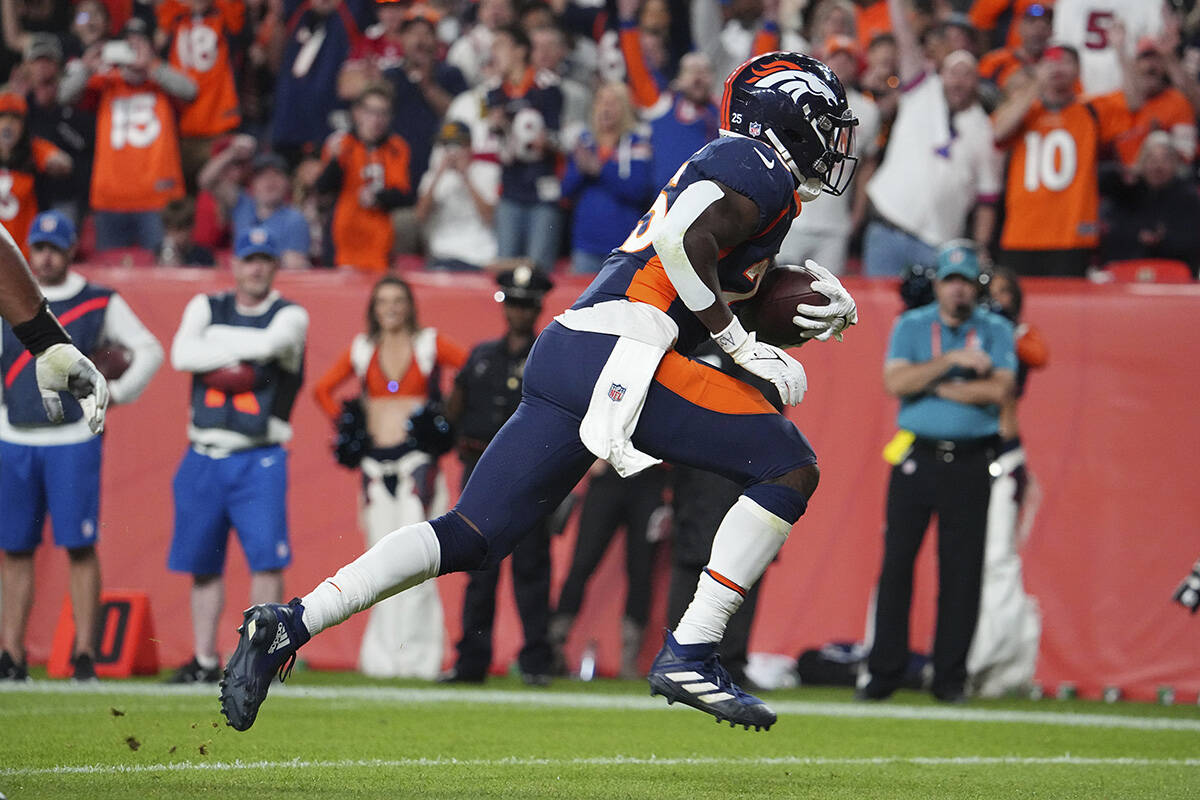 Denver Broncos running back Melvin Gordon III (25) scores a touchdown against the San Francisco ...