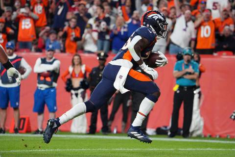 Denver Broncos running back Melvin Gordon III (25) scores a touchdown against the San Francisco ...
