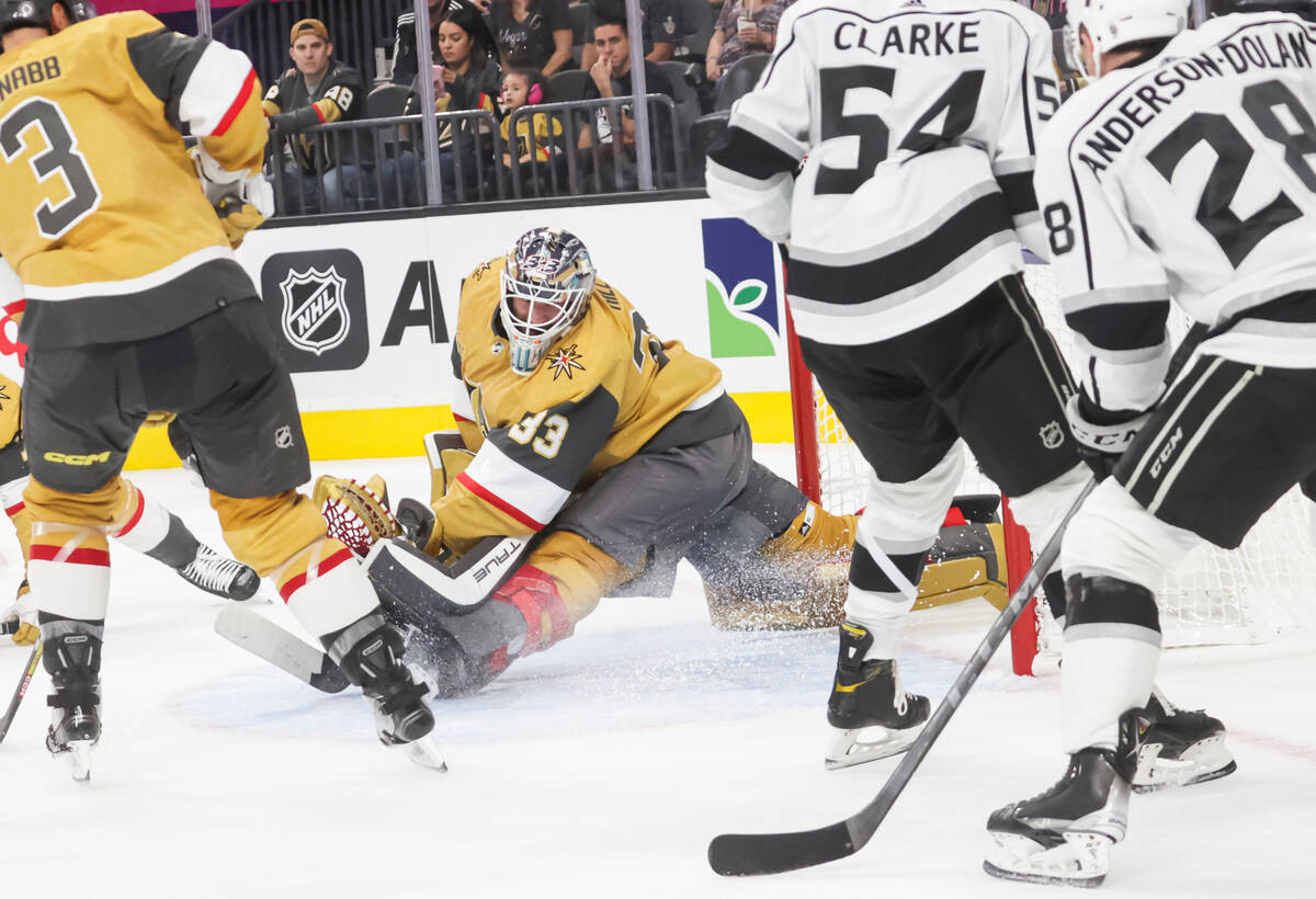 The Los Angeles Kings score a goal past Golden Knights goaltender Adin Hill (33) during the sec ...