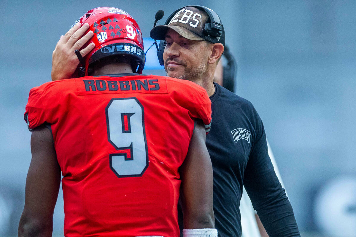 UNLV Rebels running back Aidan Robbins (9) is congratulated on another score by UNLV Rebels Hea ...