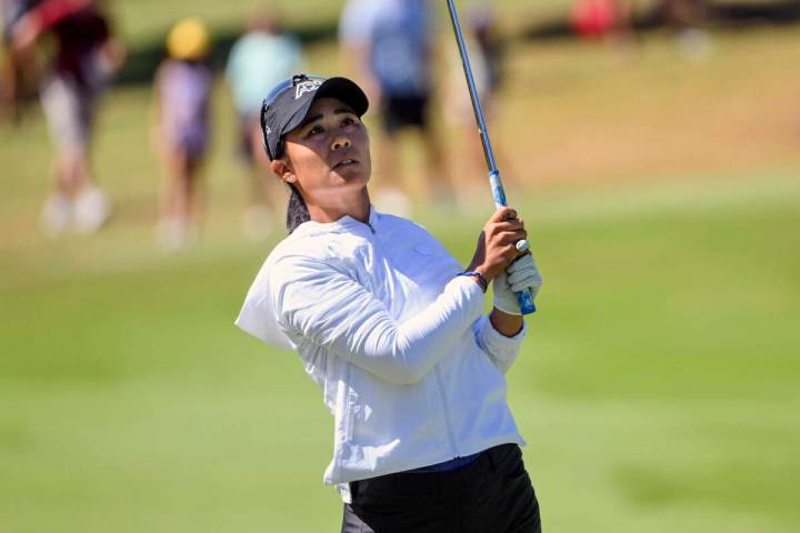 Danielle Kang, of the United States, watches her shot on the 16th hole during the final round o ...
