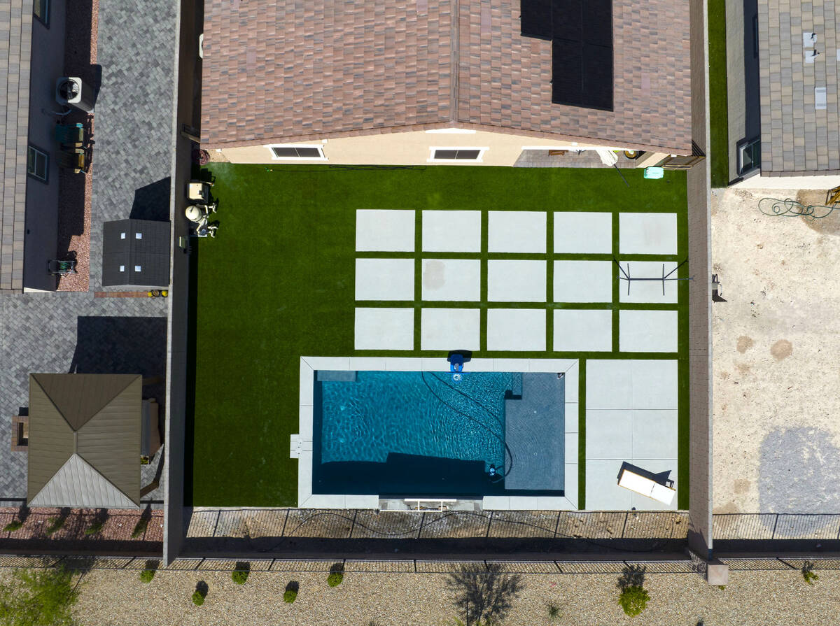 An aerial view of the backyard of the house where police officers shot a man is photographed, o ...
