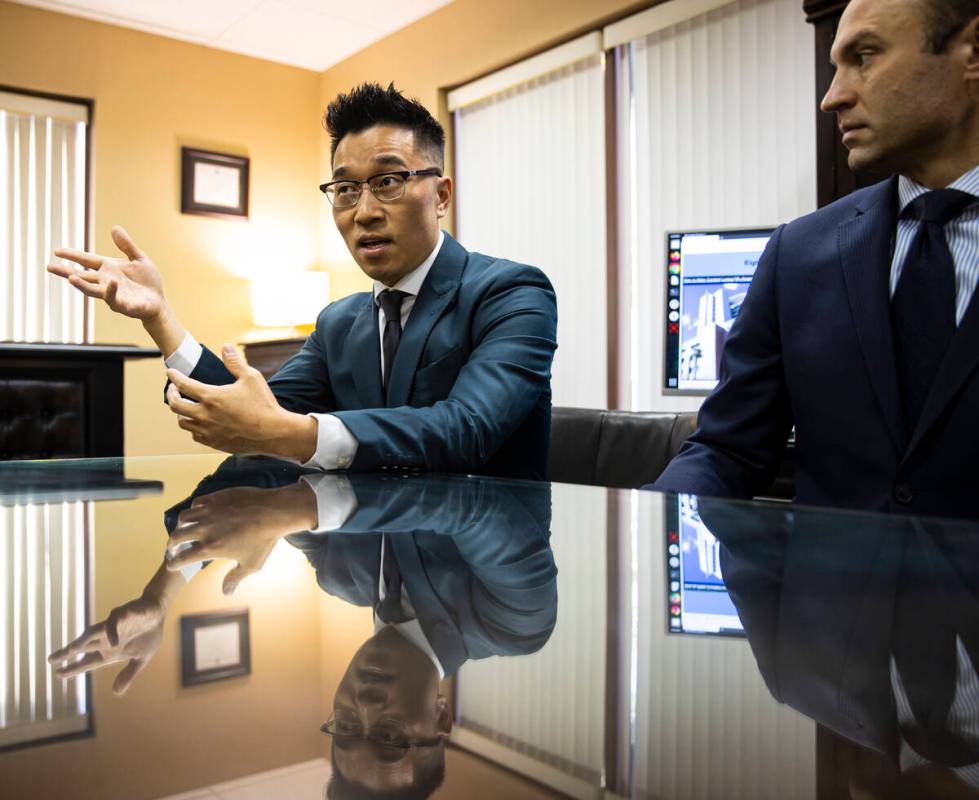 Zeng Lin, who was accused of sexual assault, speaks alongside attorney Warren Geller, after cha ...