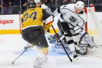 Los Angeles Kings defenseman Mikey Anderson (44) defends the net as Golden Knights forward Bren ...