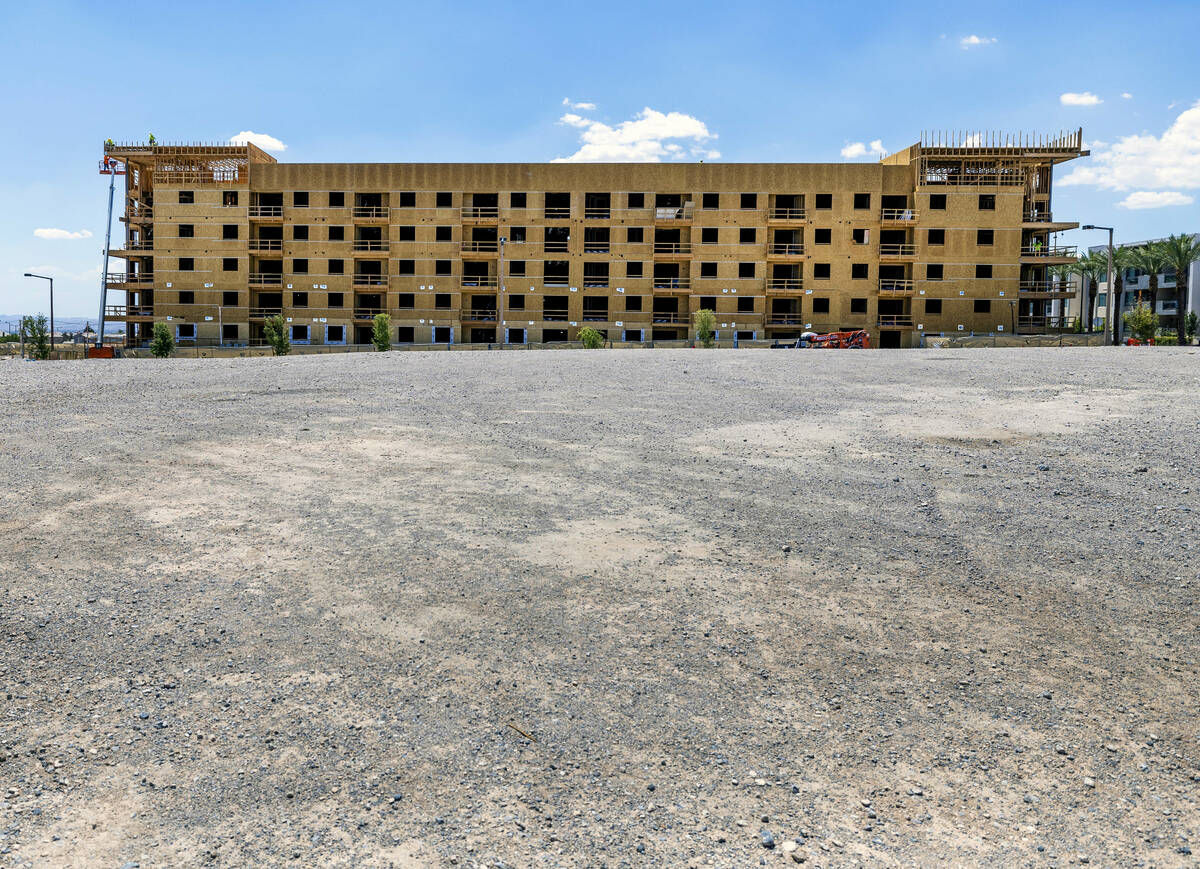 Construction continue on a new apartment building next to the existing Tanager apartment comple ...