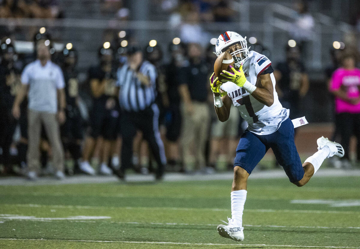 Liberty wide receiver Jayden Robertson (7) looks in a long reception for a touchdown over Faith ...