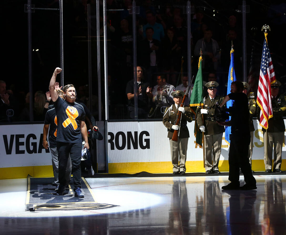 Members of the Route 91 festival team are introduced before an NHL hockey game between the Vega ...