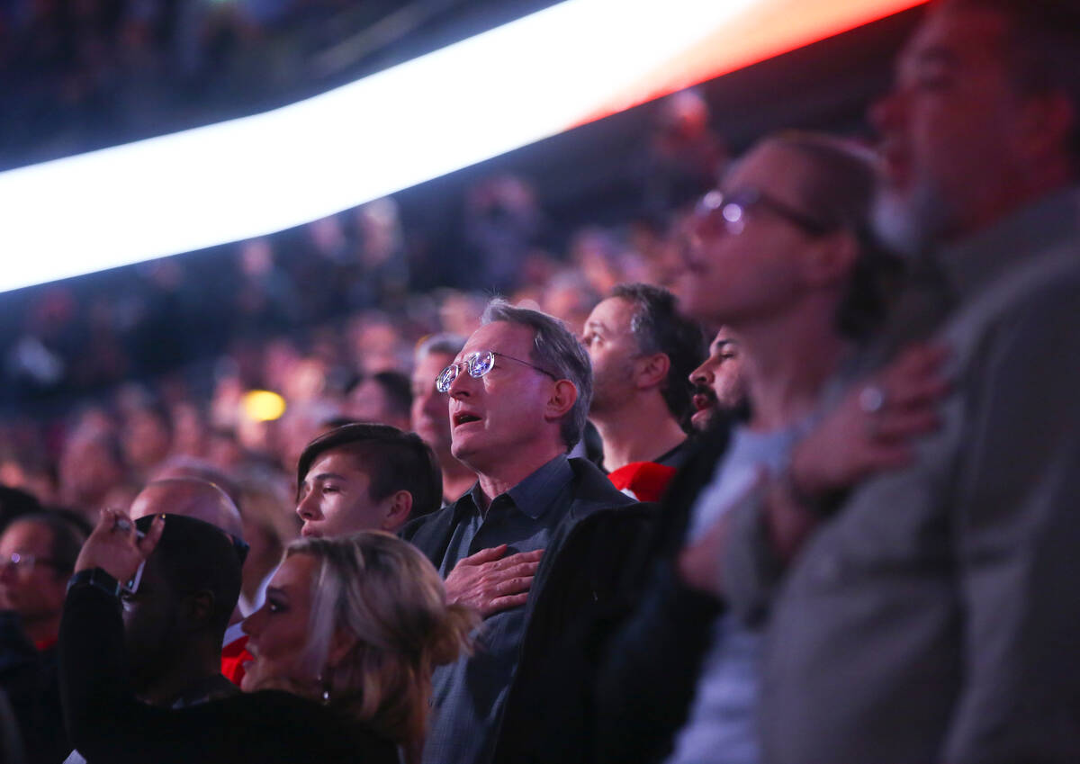Fans sing the national anthem before an NHL hockey game between the Vegas Golden Knights and Ar ...