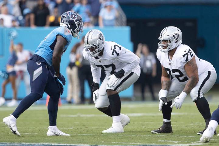 Raiders offensive tackle Thayer Munford Jr. (77) and Raiders offensive lineman Jermaine Eluemun ...
