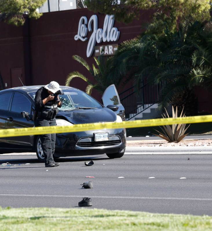 Police investigate a fatal crash on East Flamingo Road near Burnham Avenue, Tuesday, Sept. 27, ...
